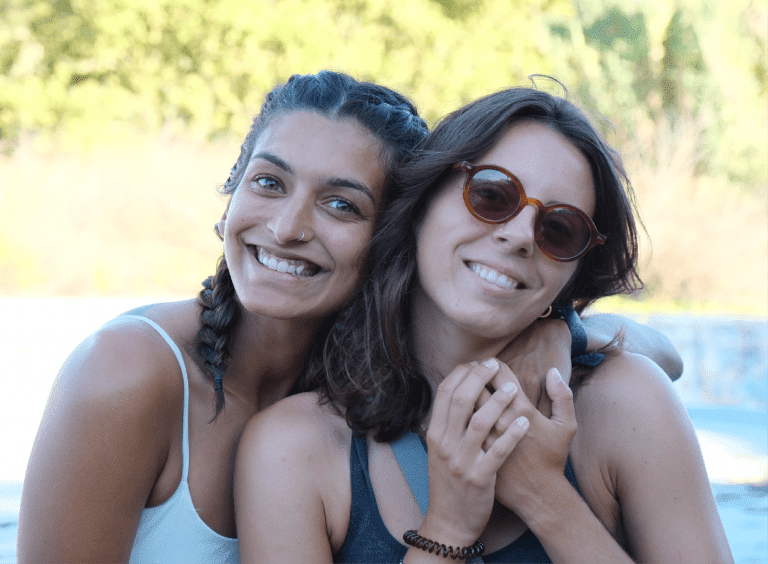 smiling girls hugging