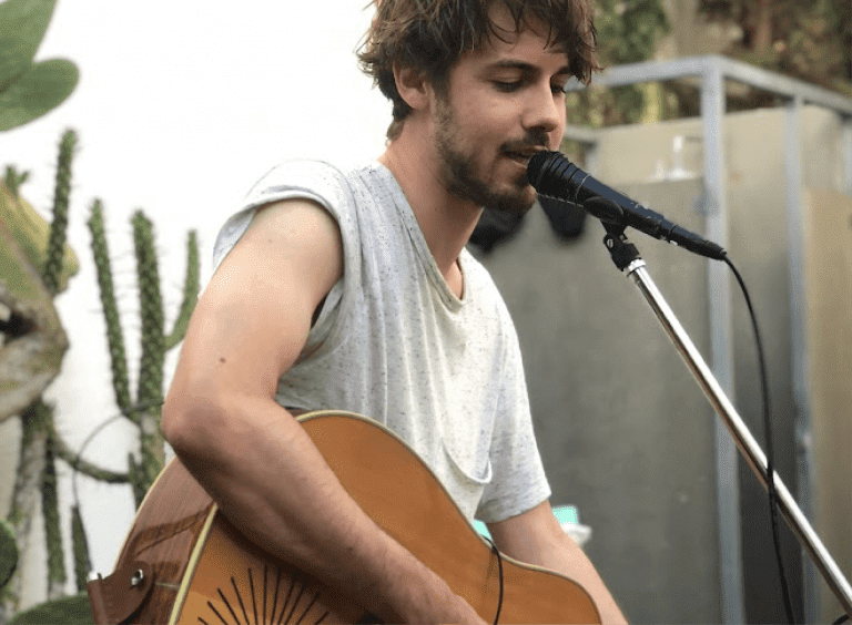 guy with a guitar singing
