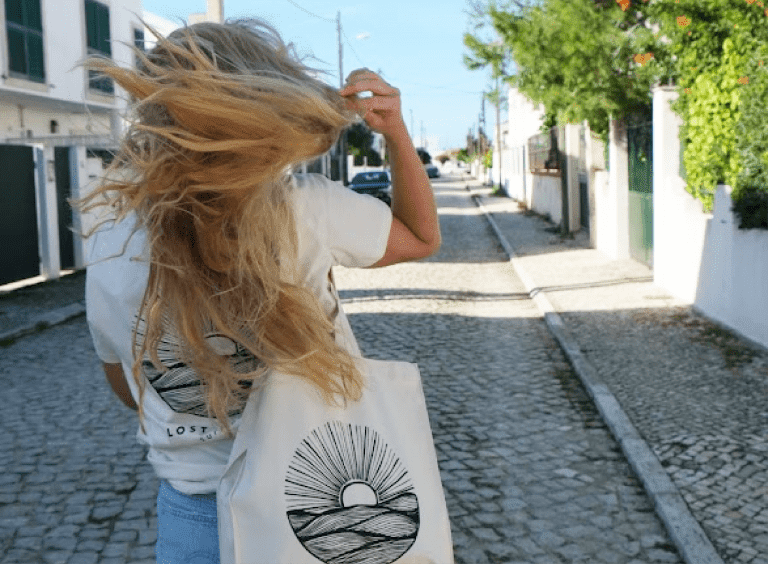 girl in the streets with lost caparica merch