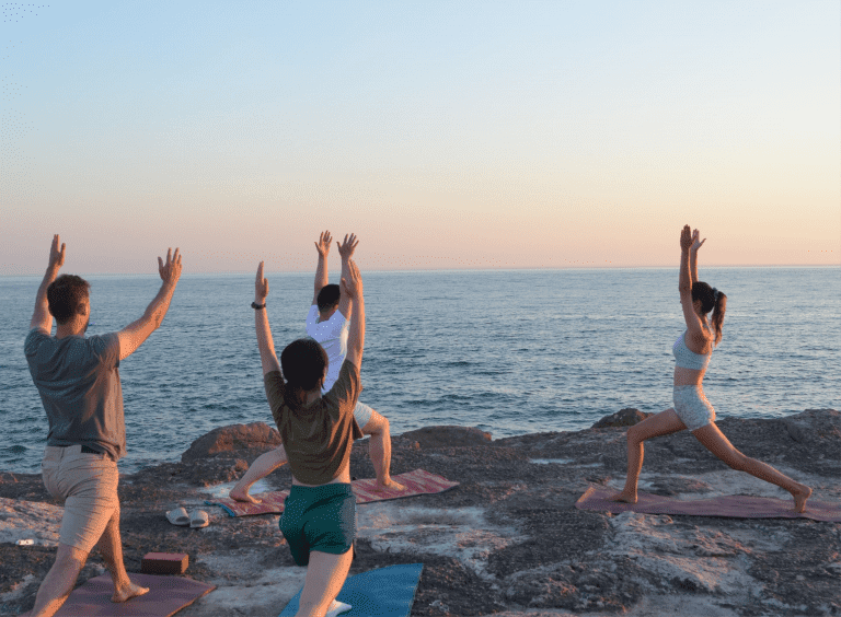 sunrise beach yoga in front of the ocean
