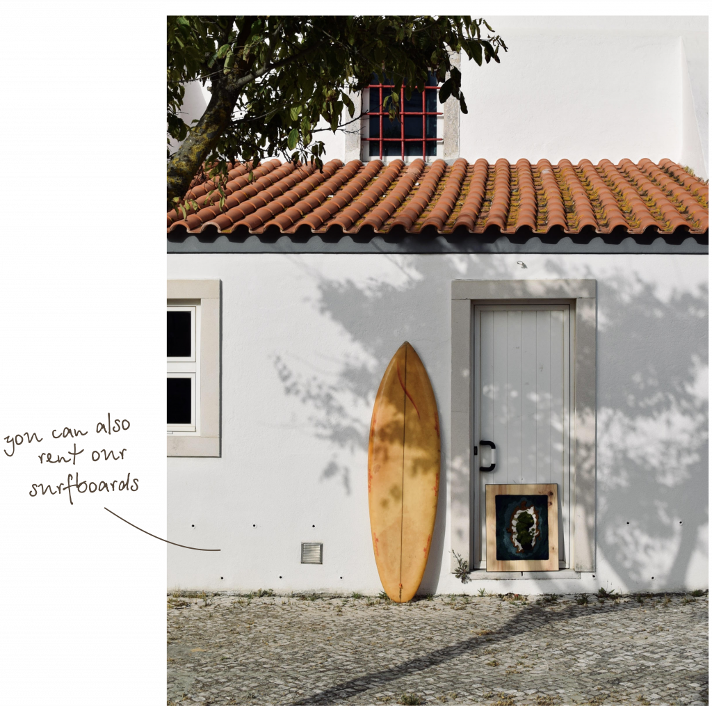 yellow surfboard standing in front of a house